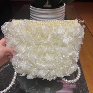 Woman purse faux pearls